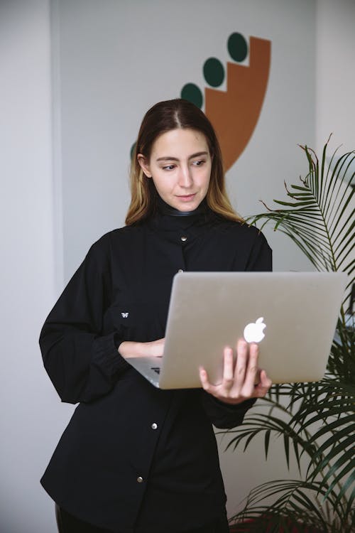 Free Photo Of Woman Using Laptop Stock Photo