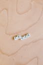 Photo Of Scrabble Pieces On Wooden Surface