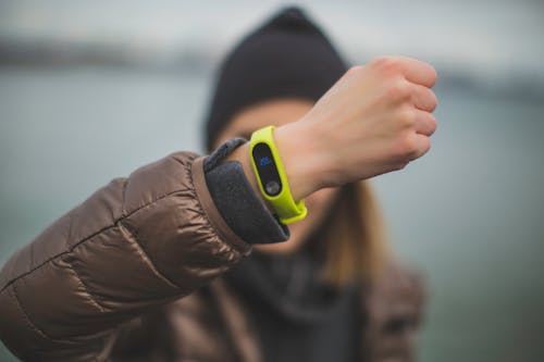 Person Wearing Green Xiaomi Band