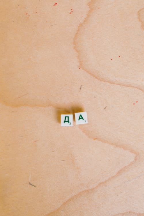 Free Photo Of Alphabet Tiles On Wooden Surface Stock Photo