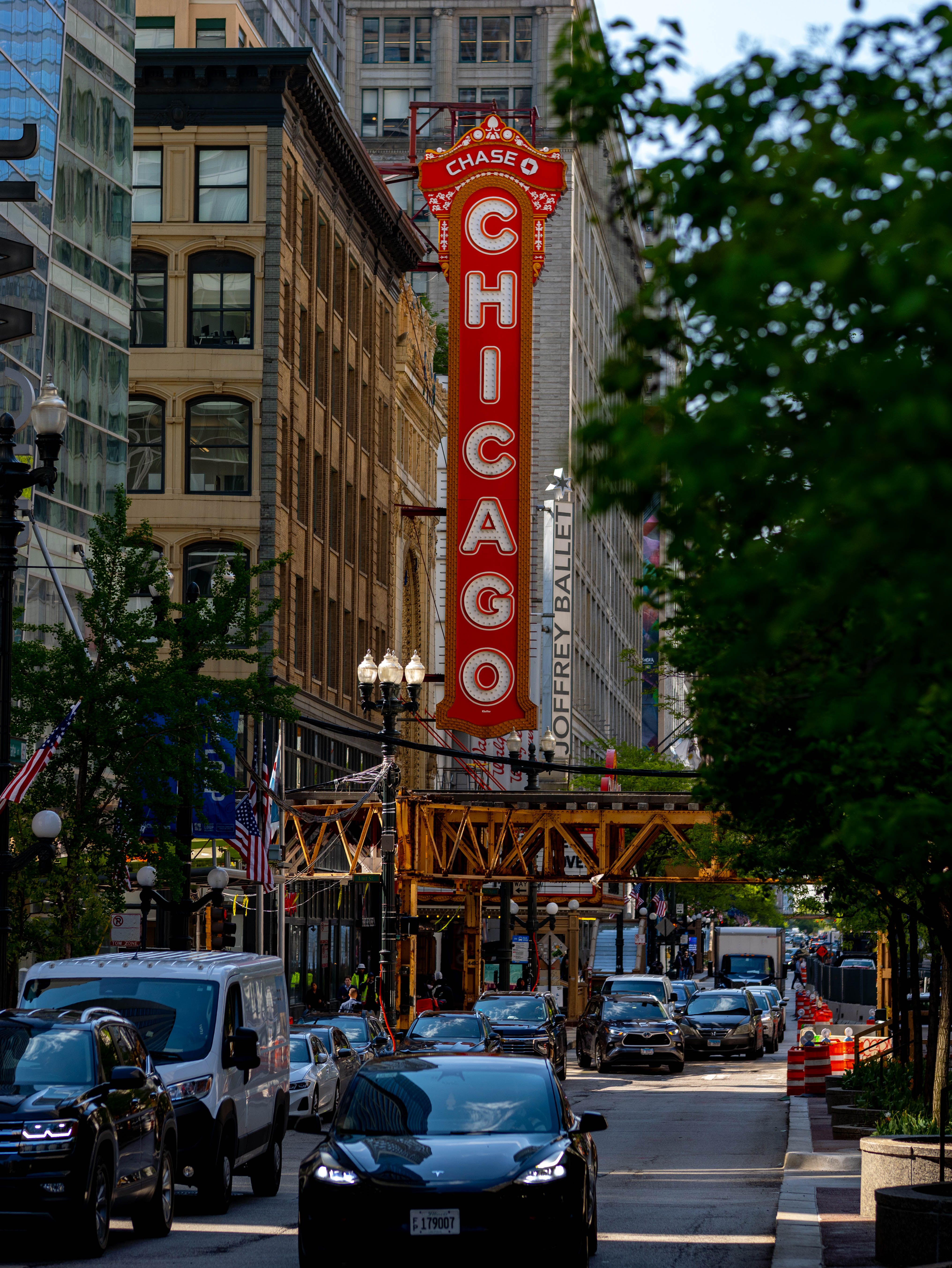 Iconic Chicago Theater Sign on Busy Street · Free Stock Photo