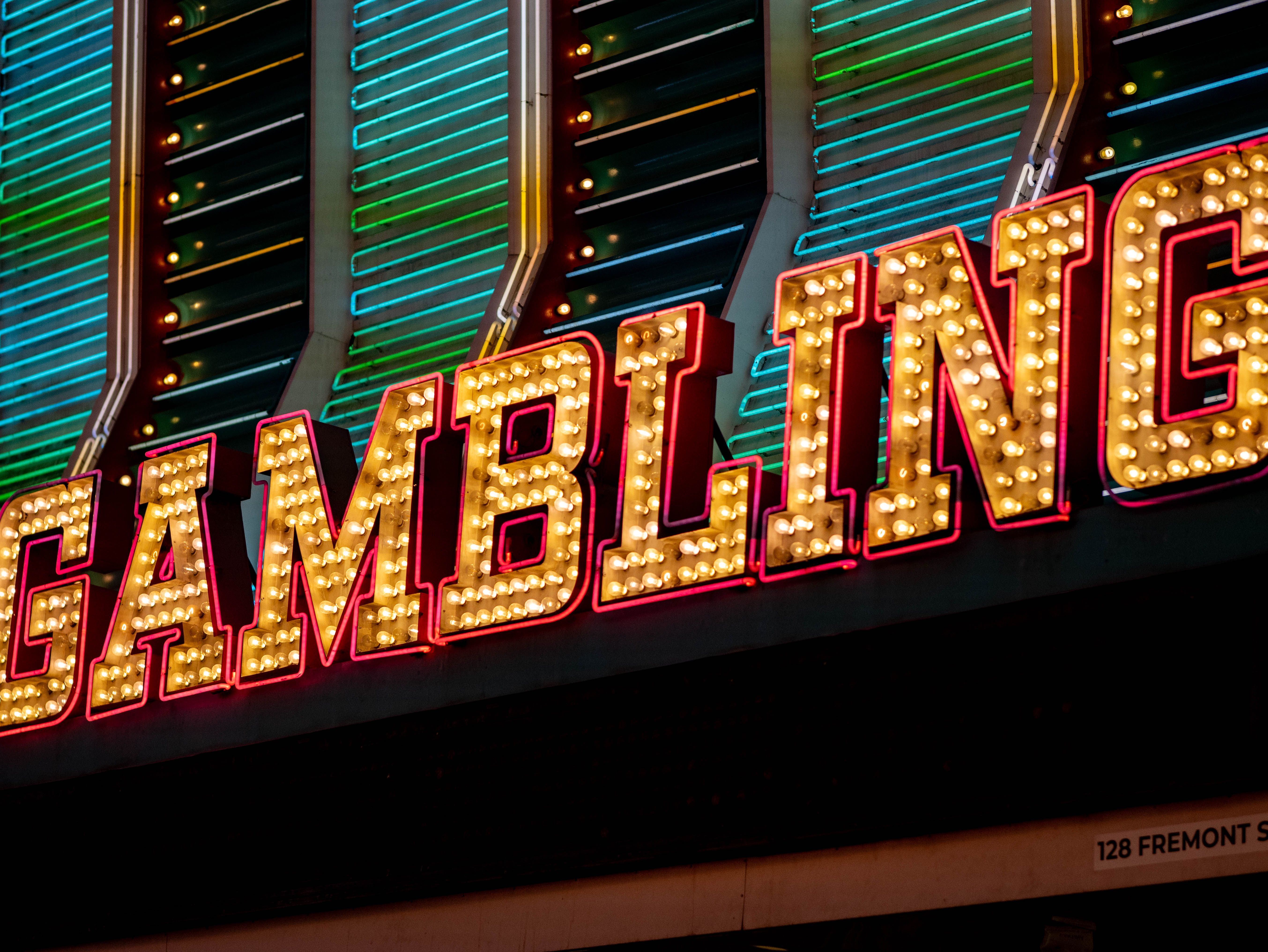 Vibrant Neon Gambling Sign in Las Vegas Night · Free Stock Photo