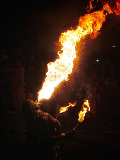 Free A captivating fire breathing act at a vibrant night festival in KL, India. Stock Photo