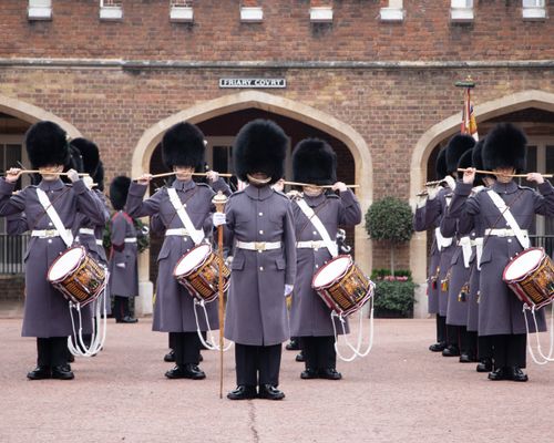 Free Uniformed soldiers performing the changing of the guard ceremony in London, UK. Stock Photo