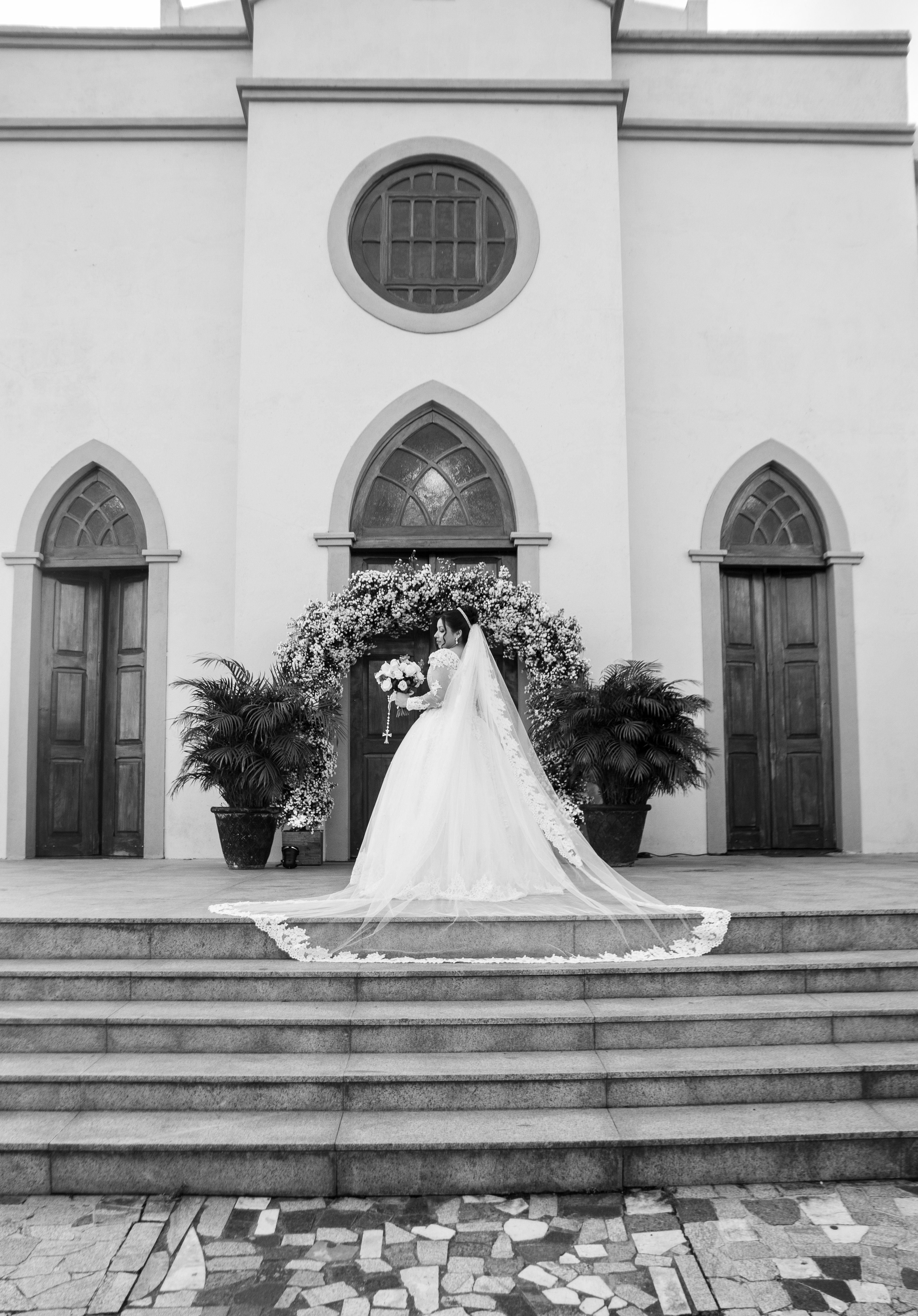 Elegant Bride Posing Outside Historic Church · Free Stock Photo
