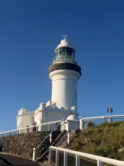 Free Captivating view of Cape Byron Lighthouse basking in sunlight with a clear blue sky. Stock Photo