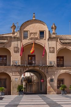 Beautiful historic town hall building with flags in Lorca, Murcia, Spain.