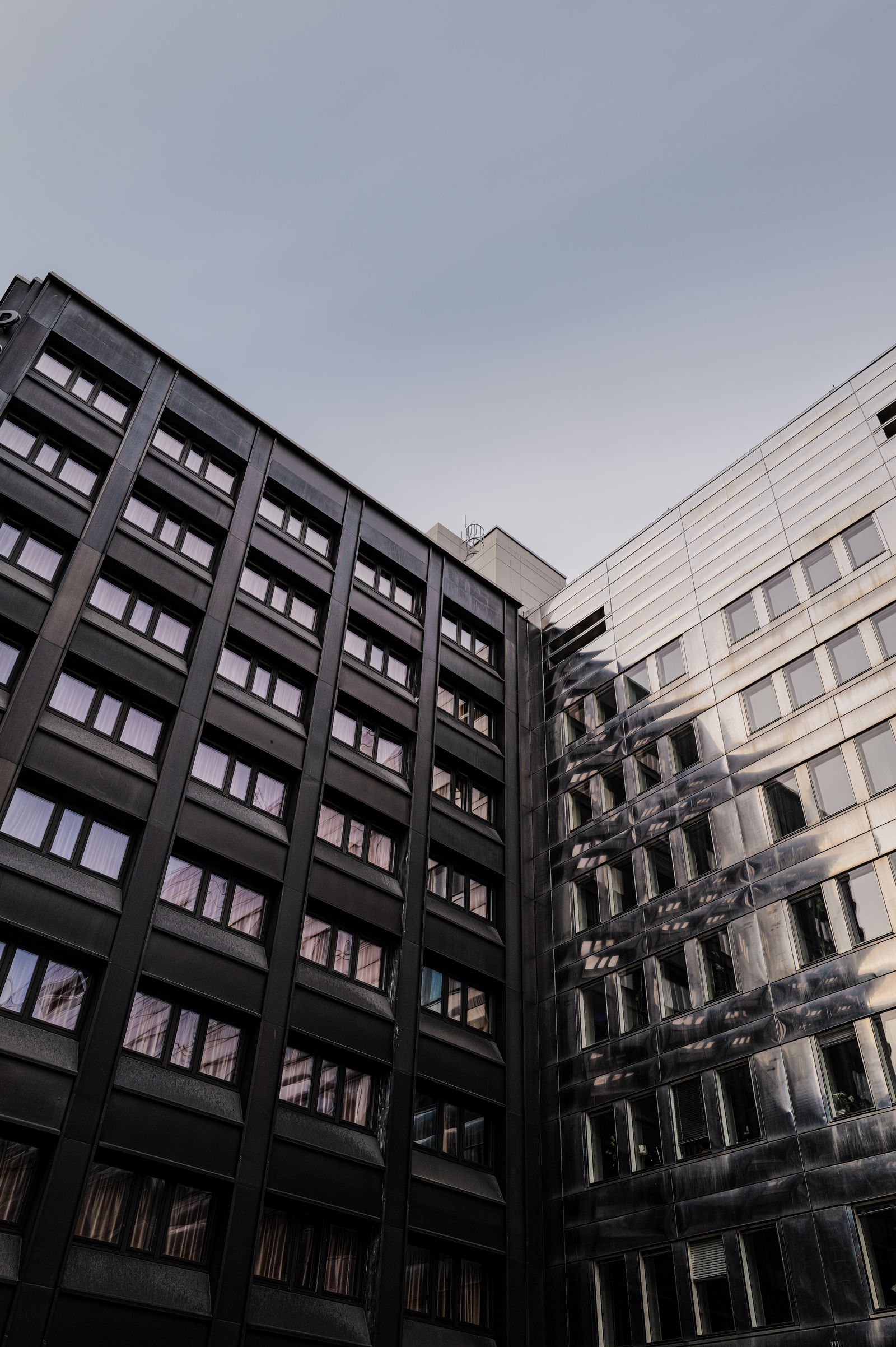 Modern Architectural Facade Under Blue Sky · Free Stock Photo