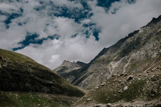 Breathtaking view of rugged mountains under a cloudy sky in Spiti Valley, Himachal Pradesh.