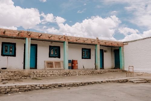Free Traditional rural house in Spiti Valley, showcasing rustic architecture under a blue sky. Stock Photo