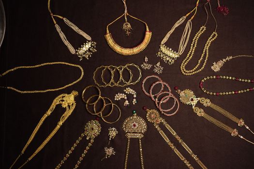 An exquisite display of traditional Indian jewelry including necklaces, bangles, and earrings.