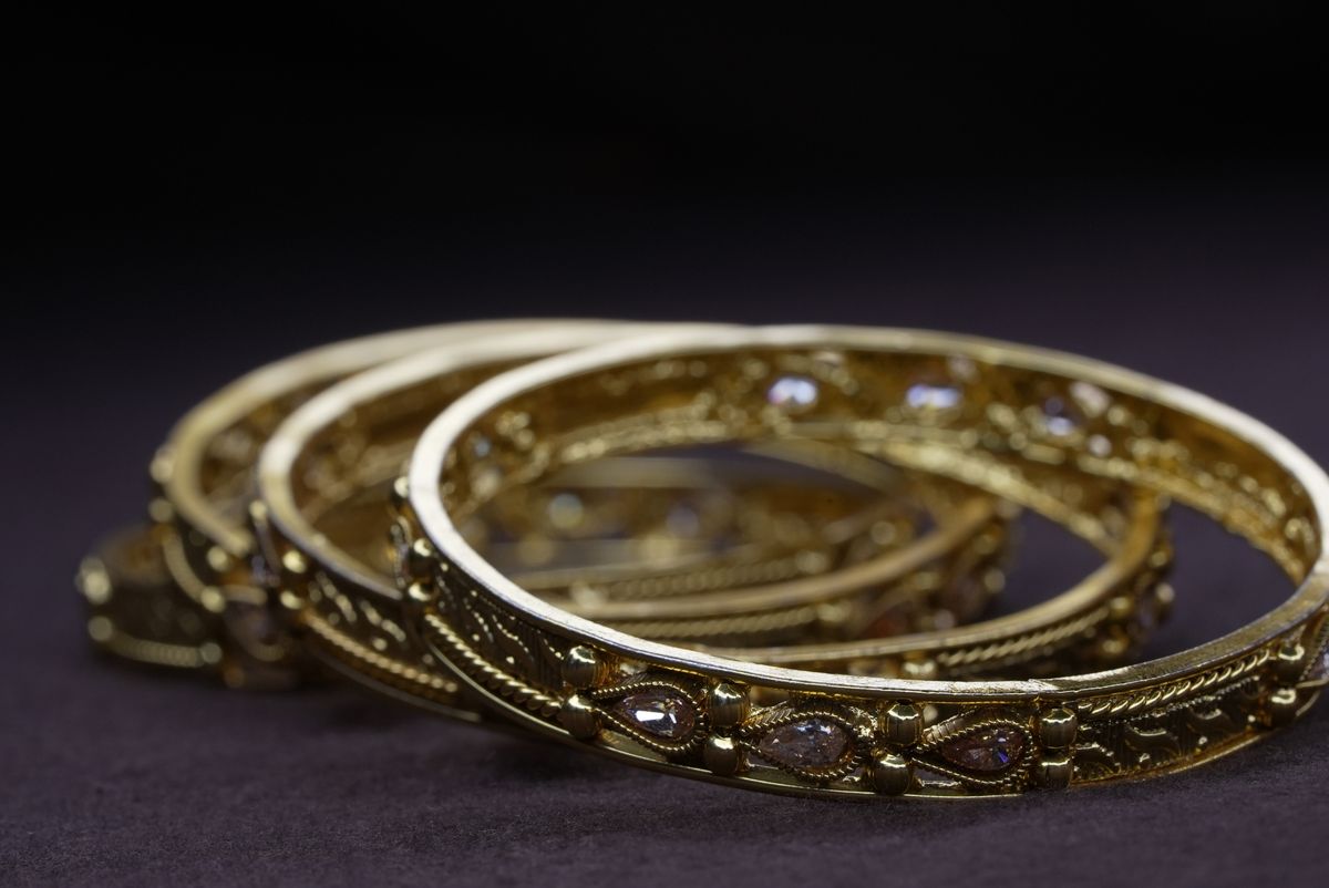 Repoussé Gold and Ruby-Accent Kadais close-up