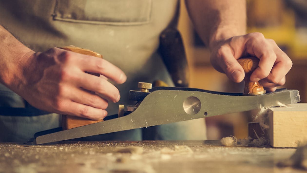 Man Hold Wood Planer