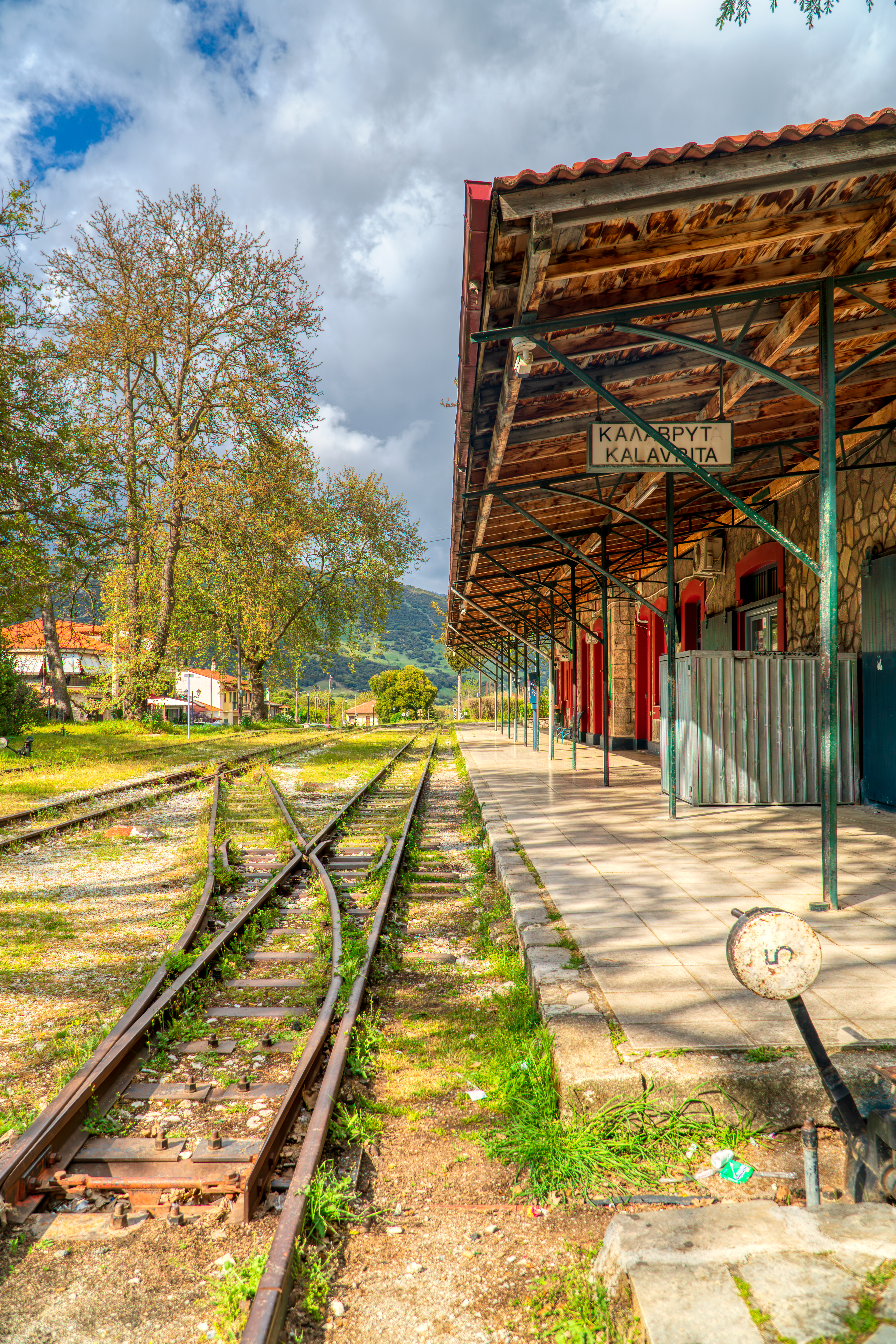 Scenic view of the Kalavryta train station with railway tracks in Greece.