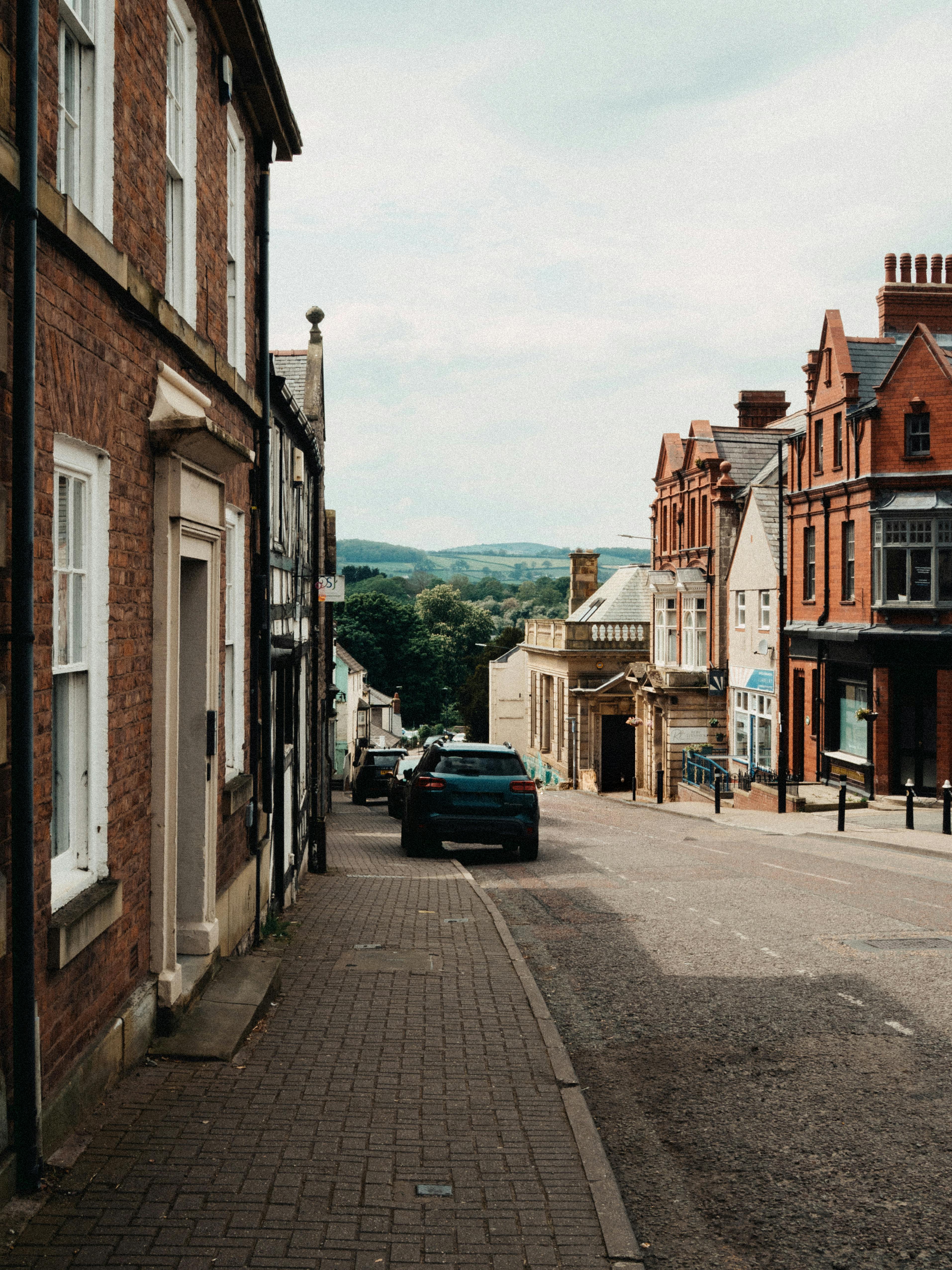 Historic street view in Saint Asaph, Wales, showcasing classic architecture and picturesque scenery.