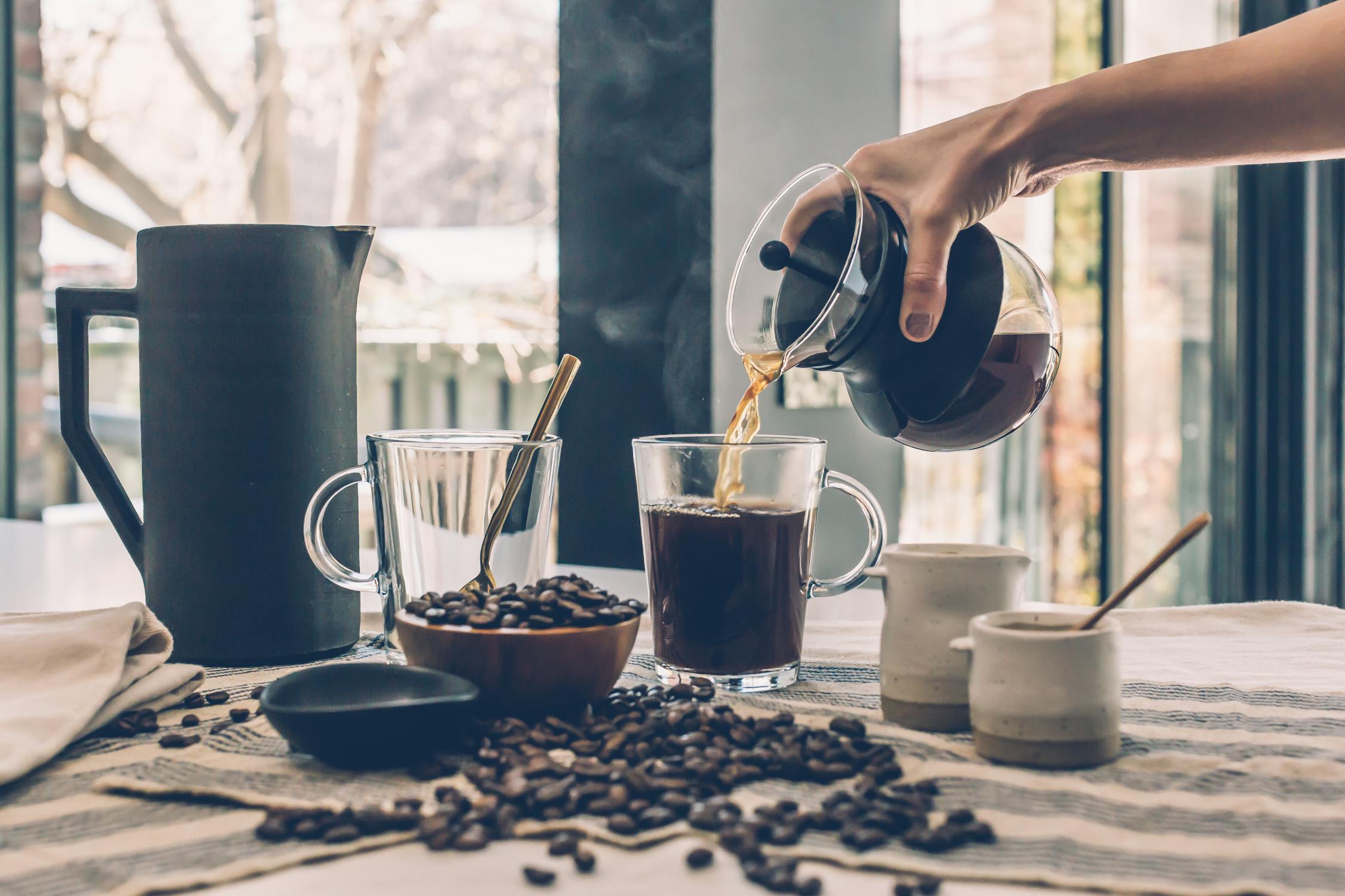 Poured hot coffee and beans 