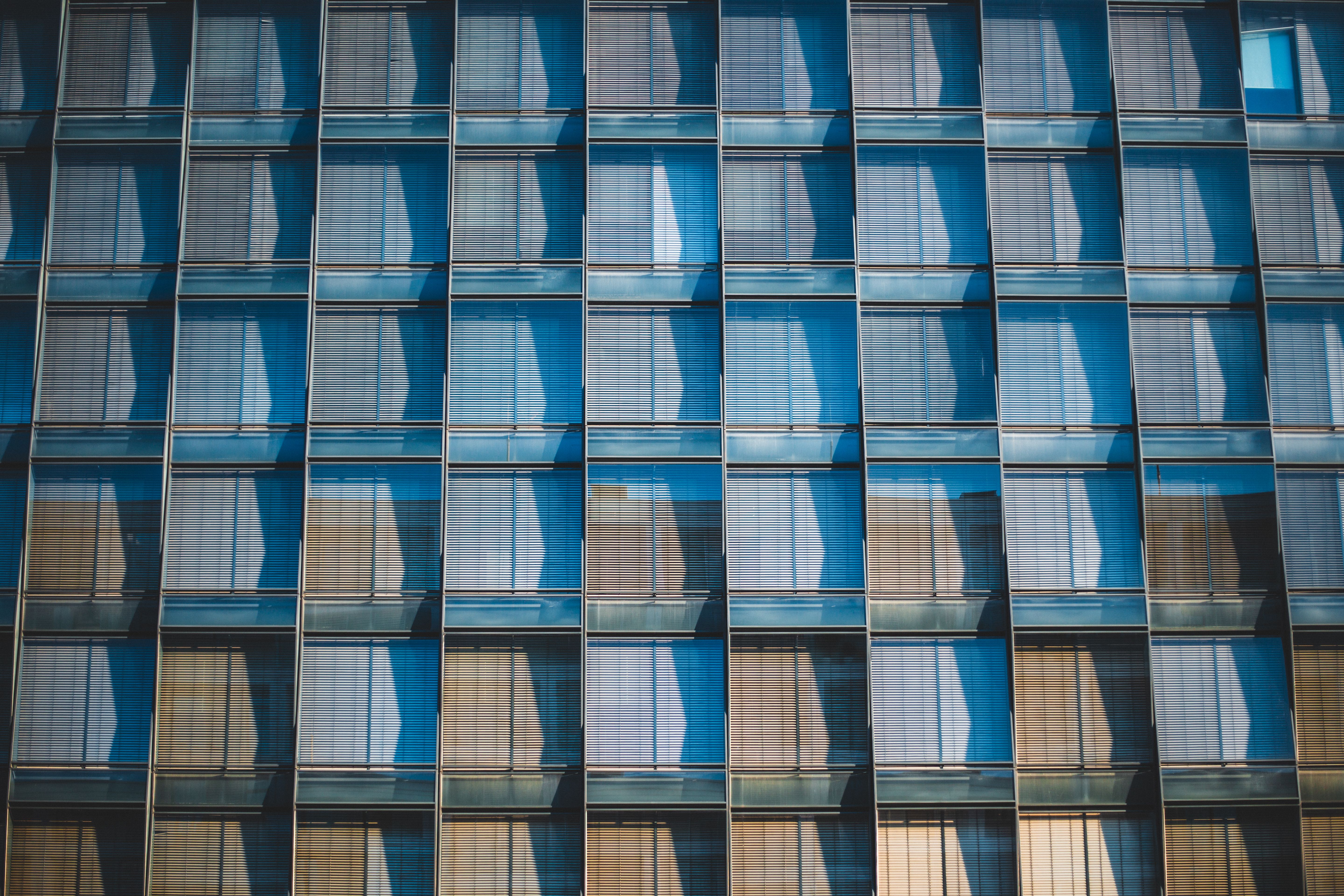 Modern Glass Building Facade with Reflections · Free Stock Photo