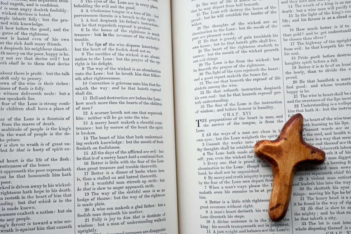 Cross With Scripturs Wooden Cross on Open Bible with Scripture · Free Stock Photo