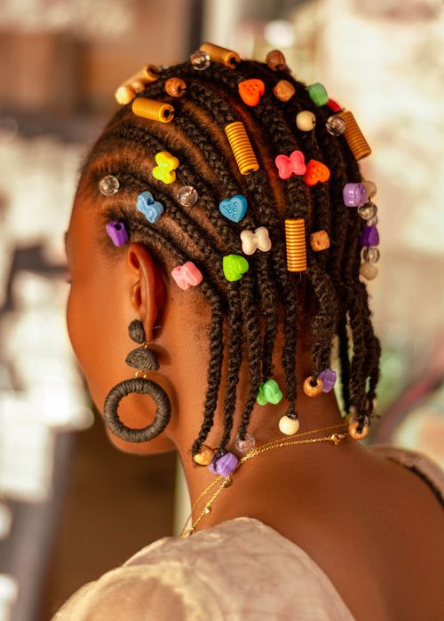 Free Close-up of an African woman's colorful beaded hairstyle, highlighting traditional beauty in Ado Ekiti. Stock Photo