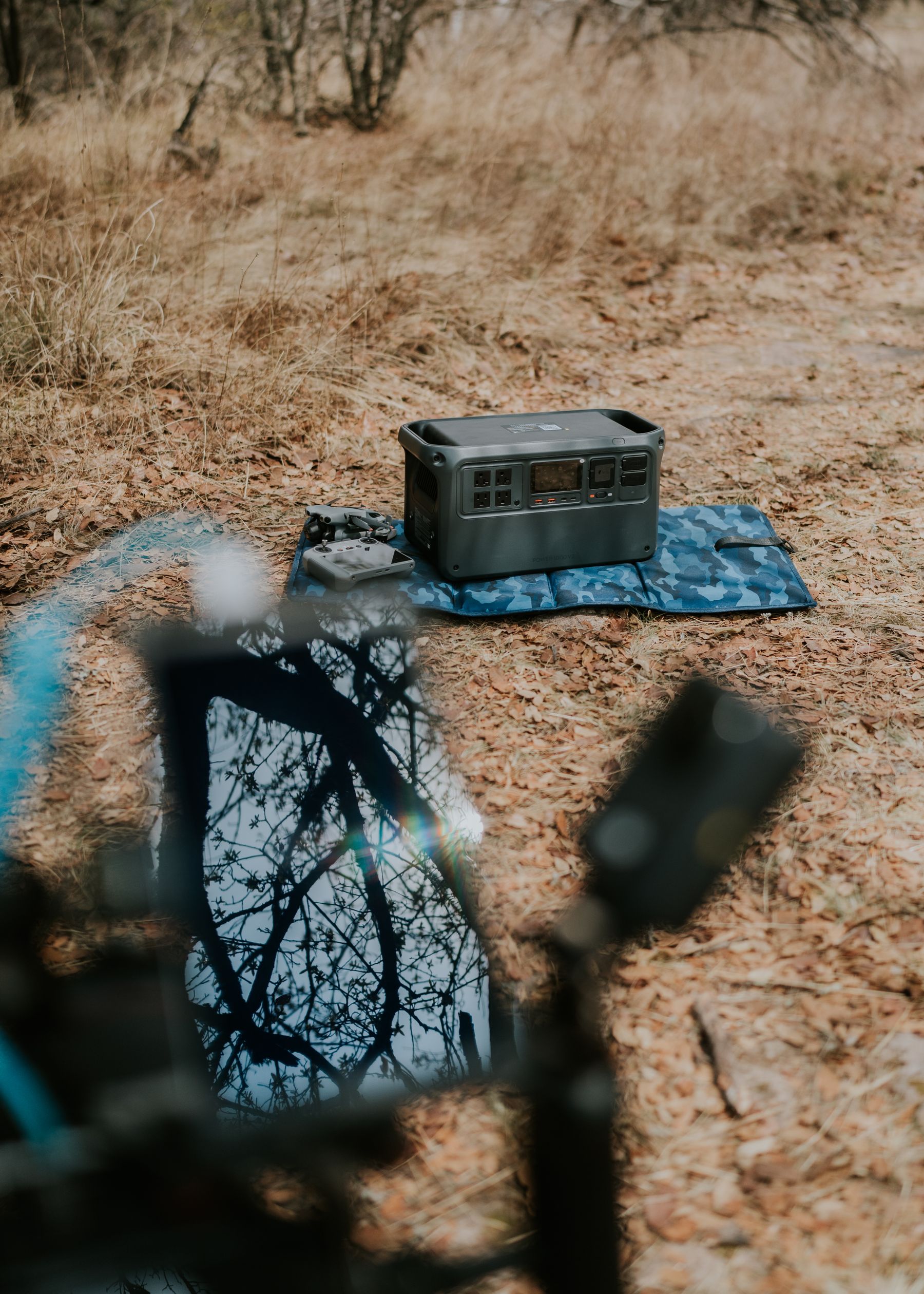 Portable power station and solar panel arranged in an outdoor natural setting