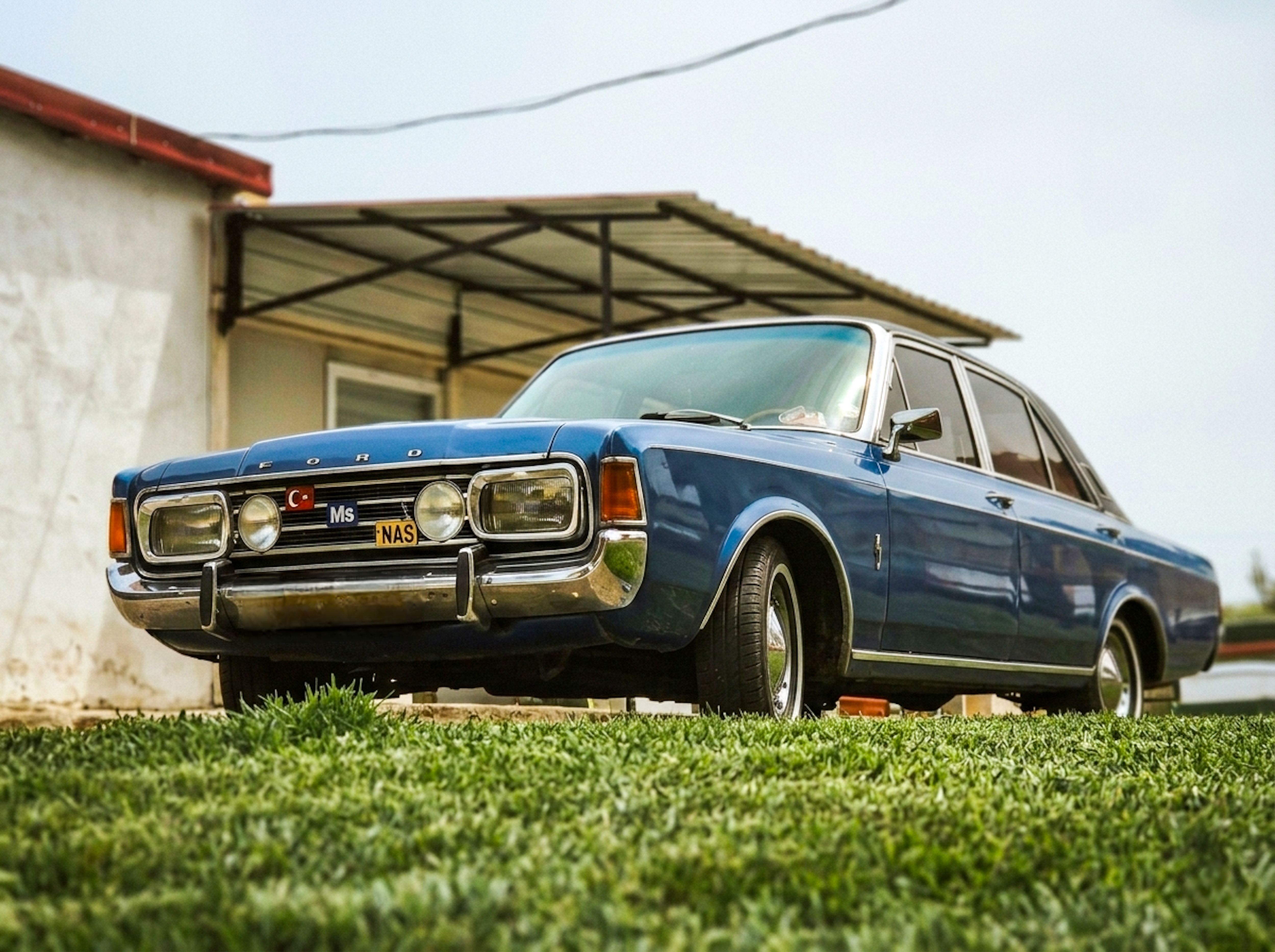 Classic Blue Vintage Car in Rural Setting · Free Stock Photo