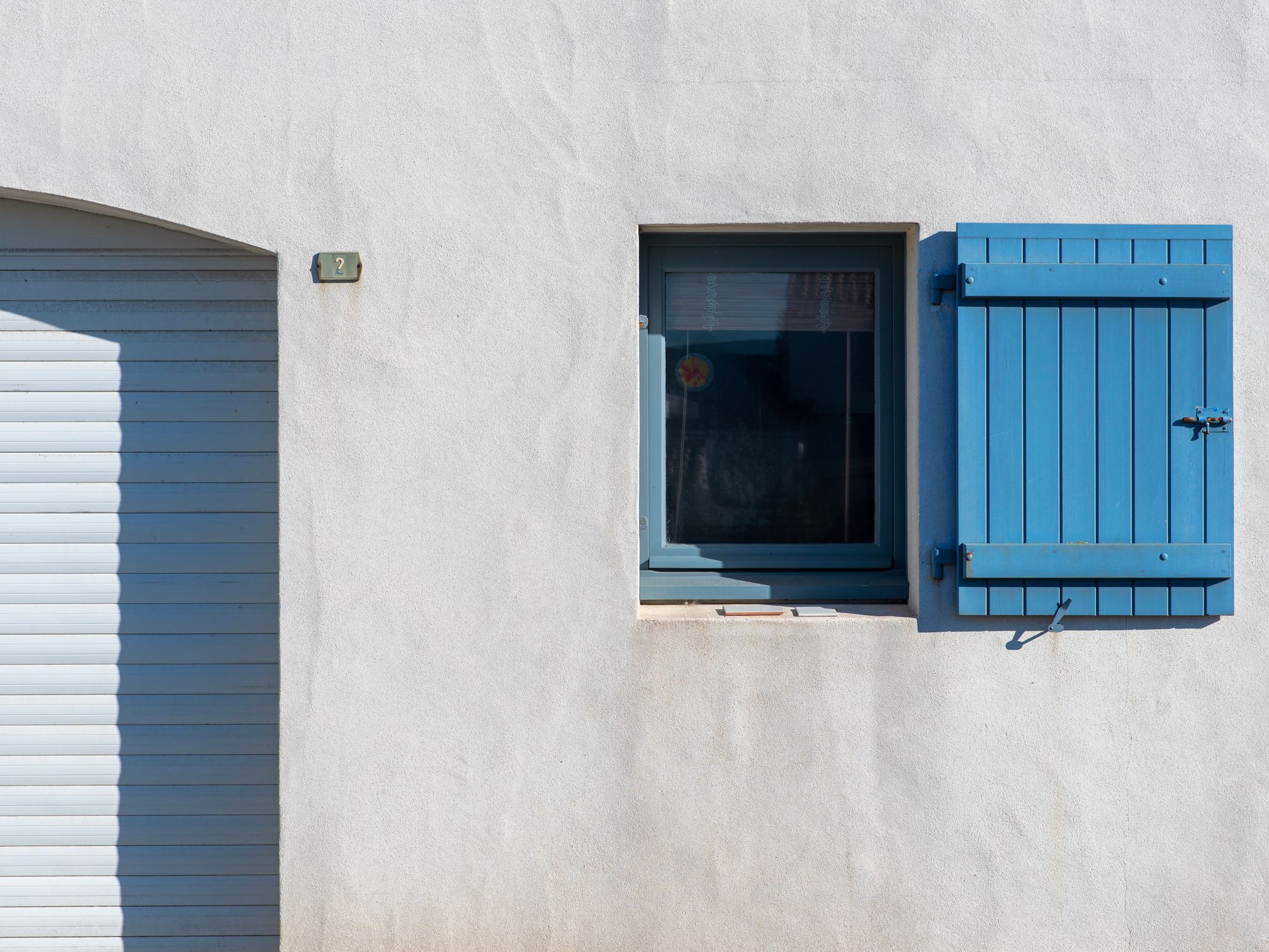 Painters & Decorators in Upton, London — professional decorator painting a wall with a roller