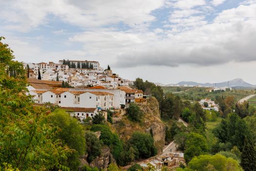 Scenic view of white houses and lush countryside in Ronda, Andalusia, Spain.
