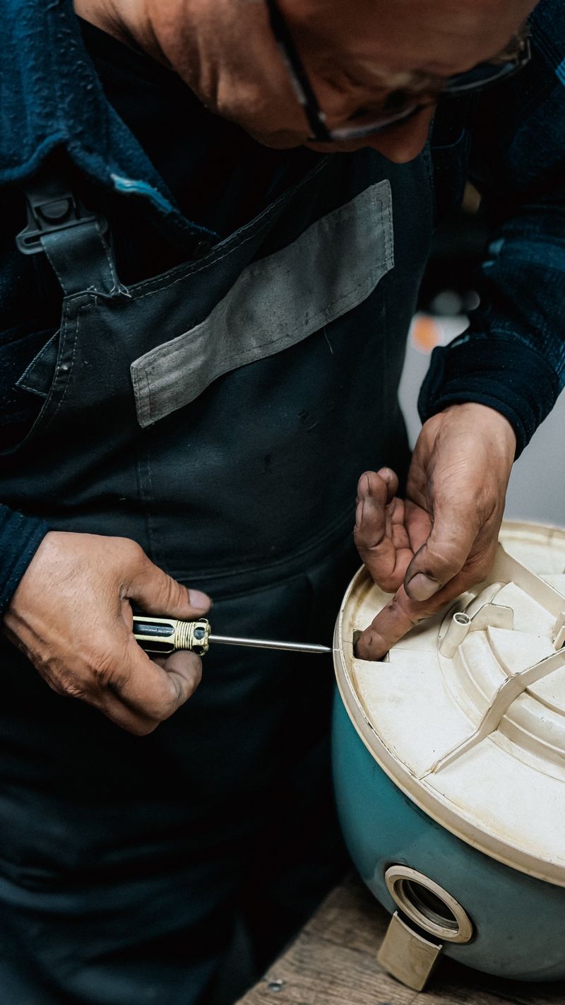 Craftsman working on a KitchenAid appliance