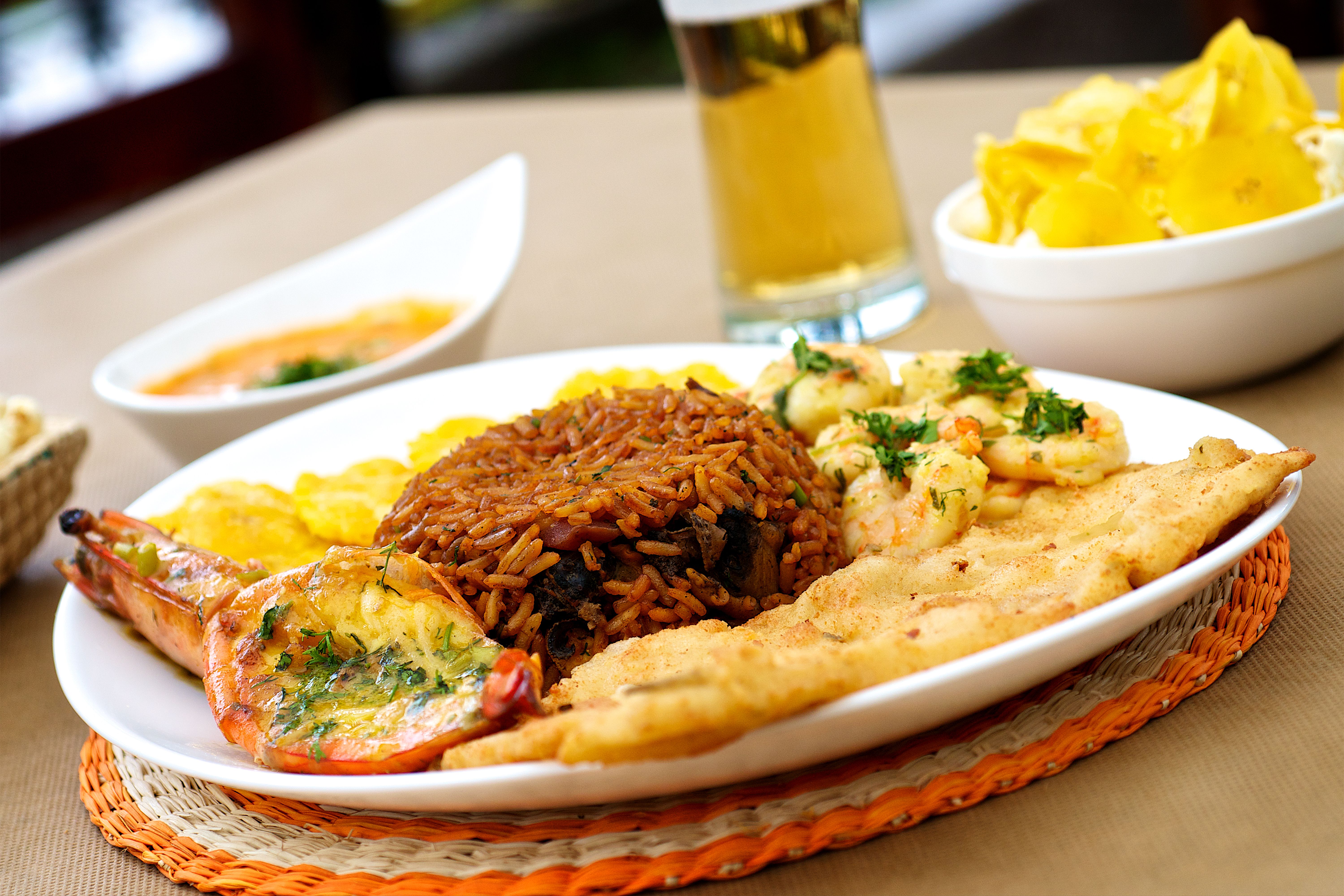 Jollof rice and fried plantains being served at a church fellowship hall