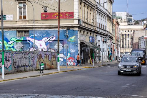 Free Colorful graffiti on building in bustling Valparaíso street, Chile. Stock Photo