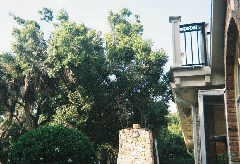 Custom stone outdoor fireplace on a flagstone patio