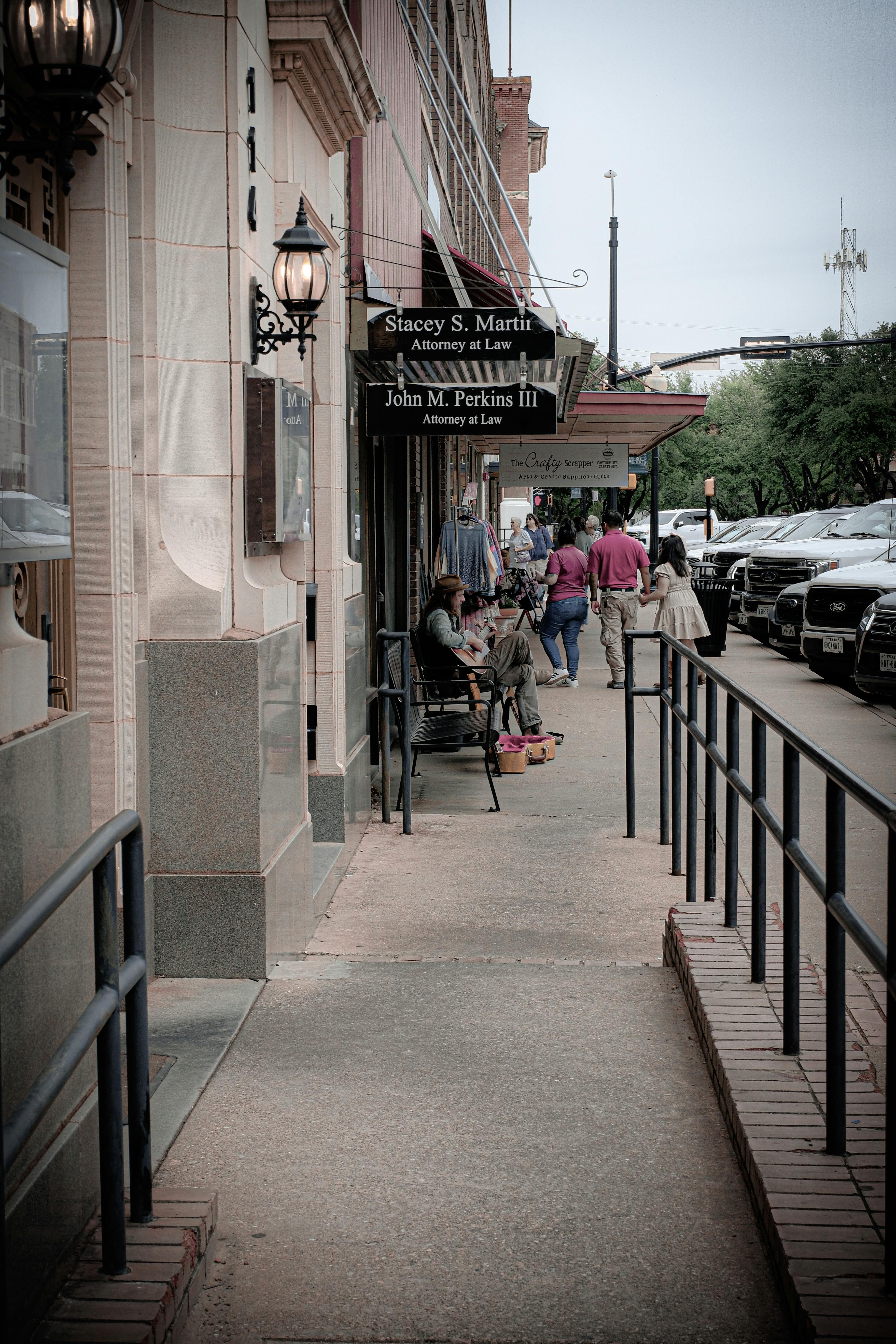 Historic North Texas downtown street scene with storefronts and pedestrians