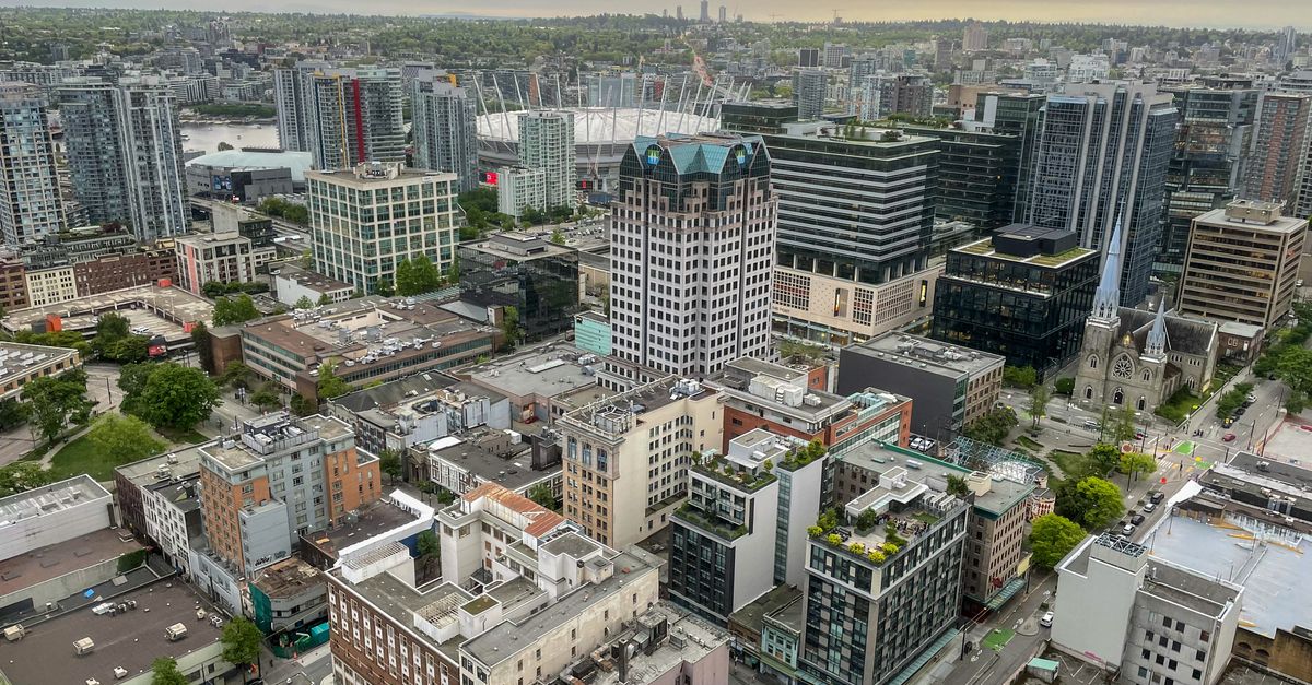Capture of Vancouver's architectural landscape from above during sunset, highlighting urban density and city life.