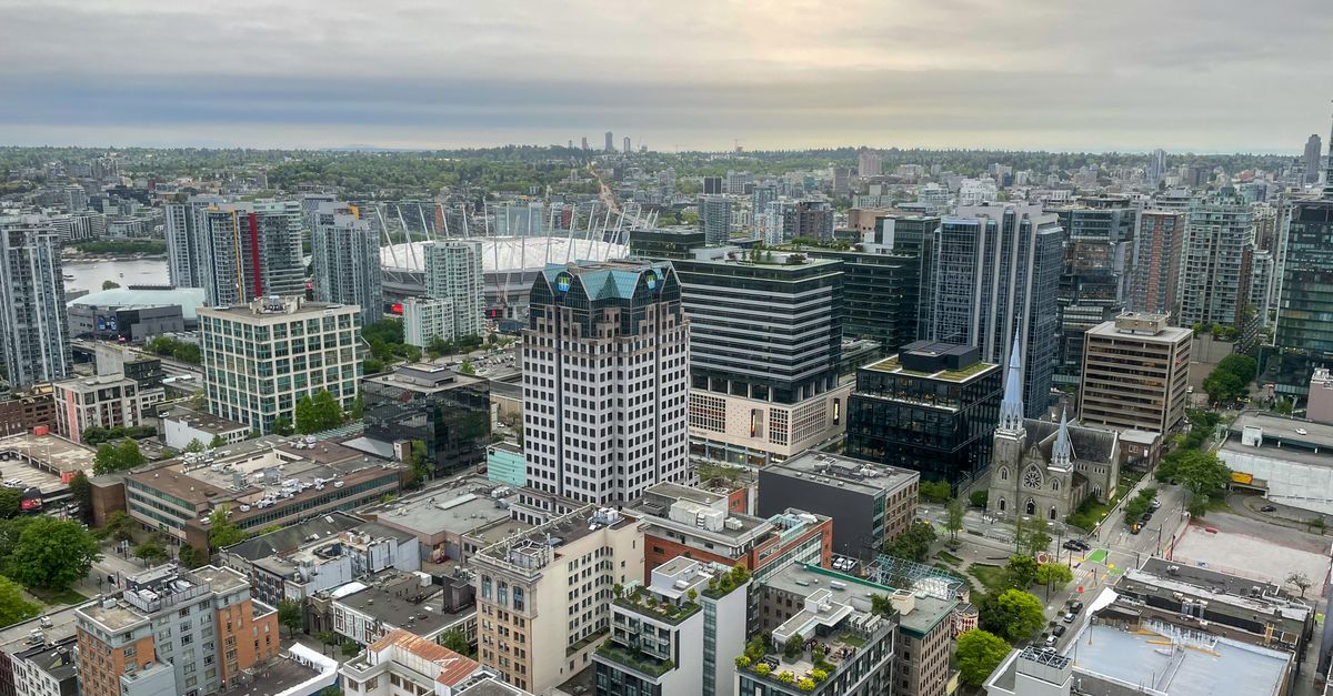 Stunning aerial view of downtown Vancouver showcasing modern architecture and scenic skyline.