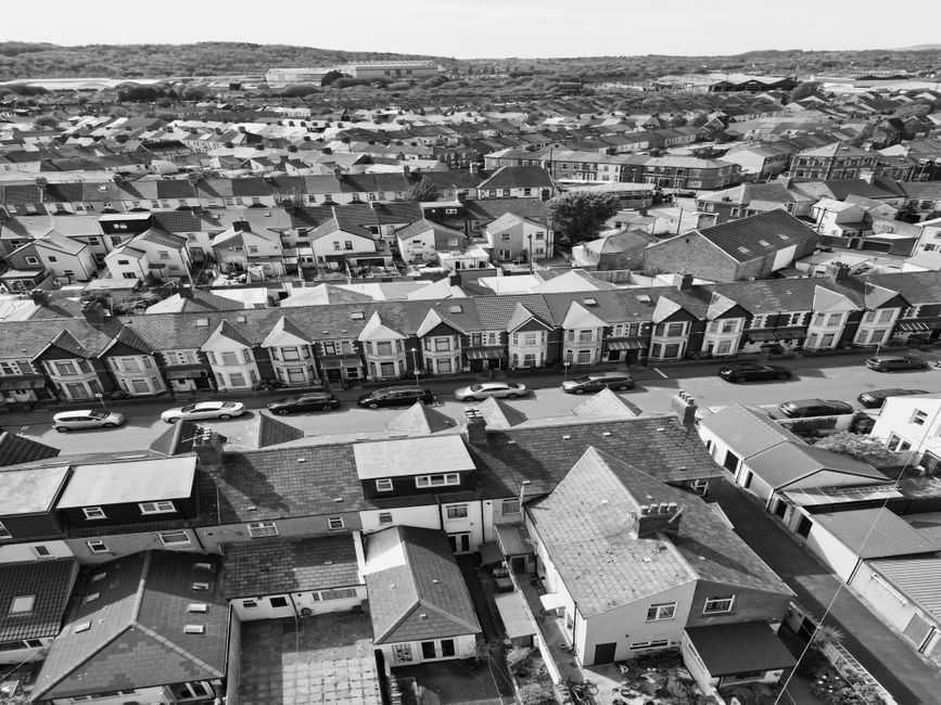 Black-and-white aerial shot capturing rows of suburban homes in Cardiff, Wales.