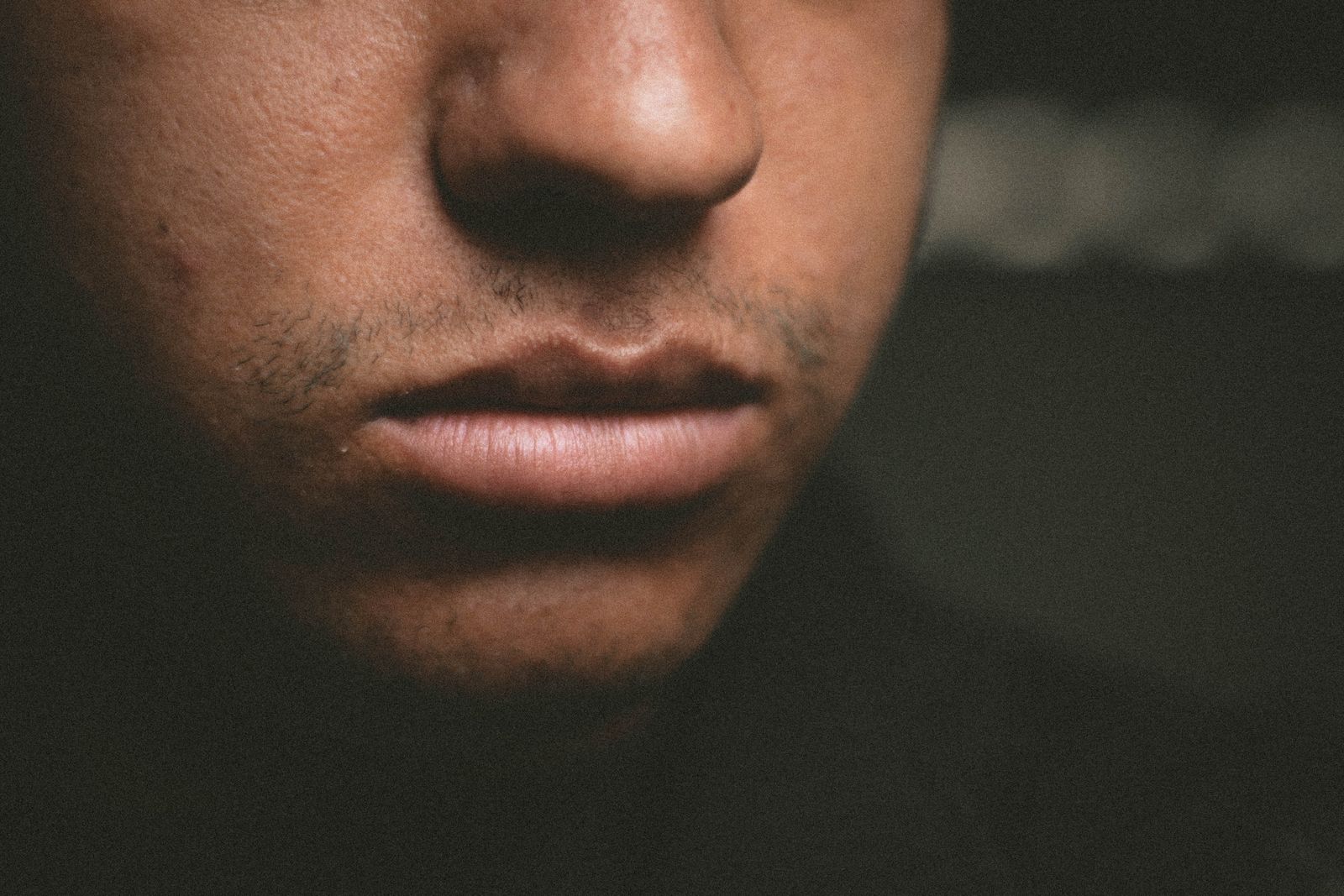 Close-up portrait lit in a single tone — photo by Wallace Chuck on Pexels