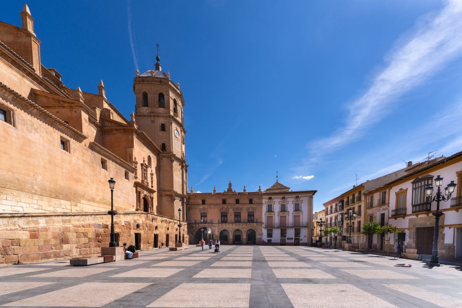 Beautiful sunny day at Plaza de España in Lorca, showcasing historical architecture and blue skies.