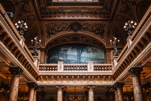 Free Explore the opulent architecture of Monaco's grand casino with detailed frescoes and ornate columns. Stock Photo