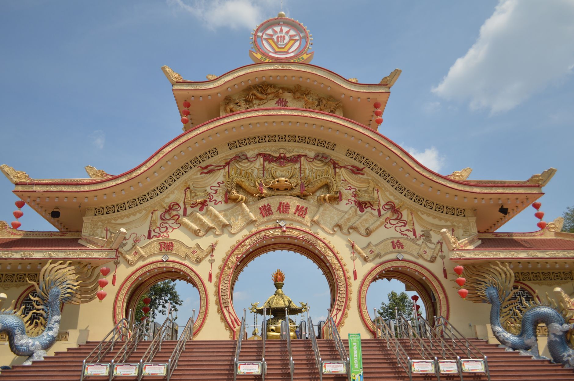 A beautifully ornate Chinese temple with vibrant dragon sculptures and intricate architectural design.