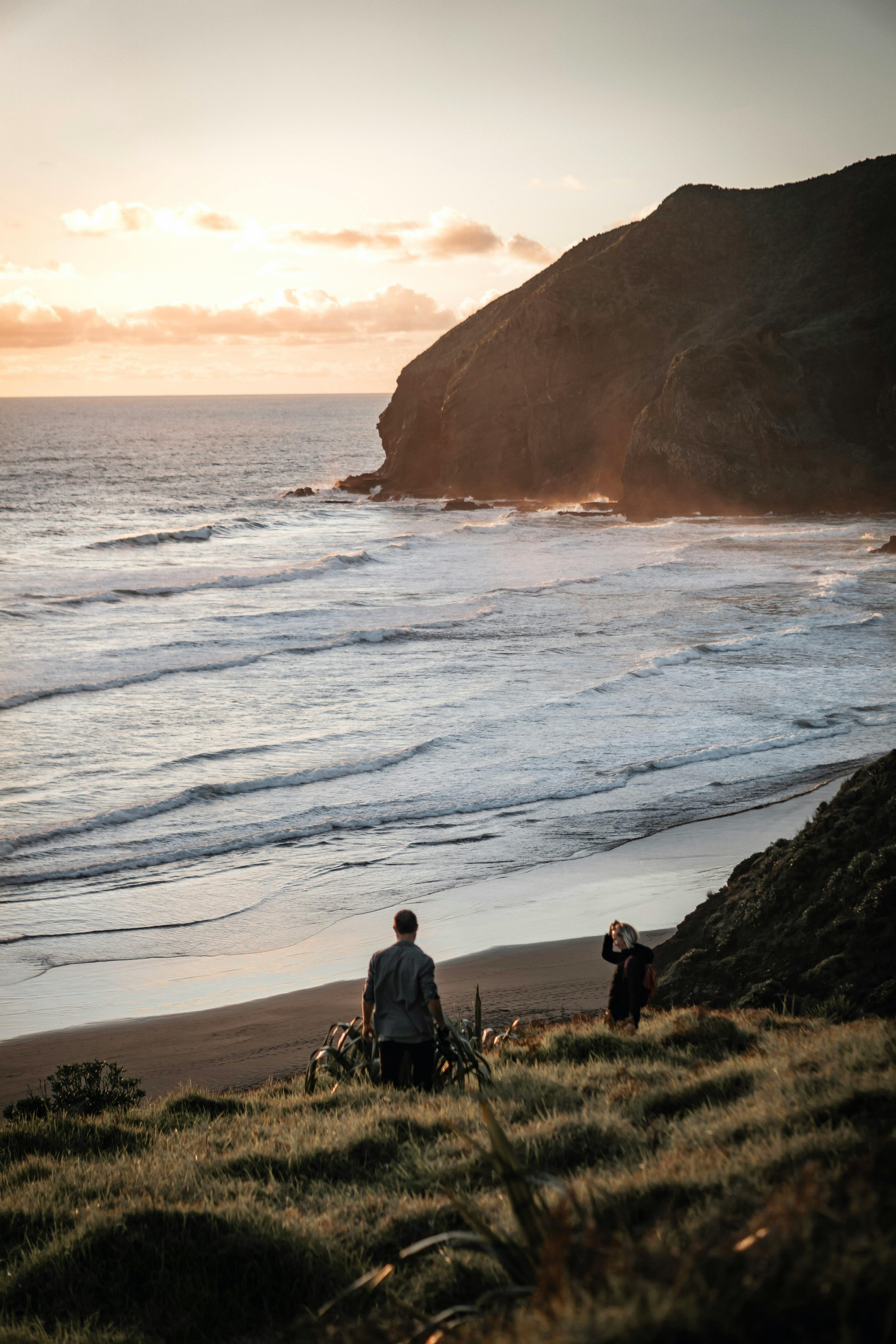 people hiking at coast