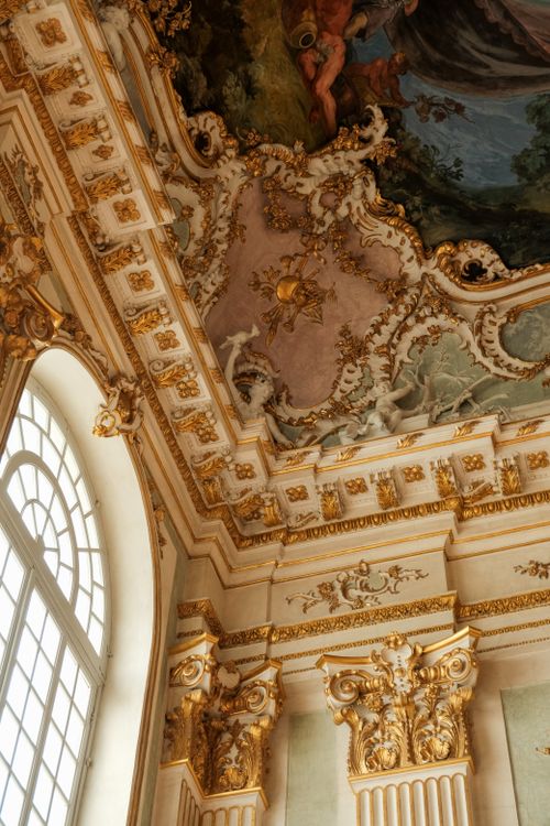 Free Intricate Baroque ceiling with frescoes and golden accents, showcasing elaborate elegance. Stock Photo