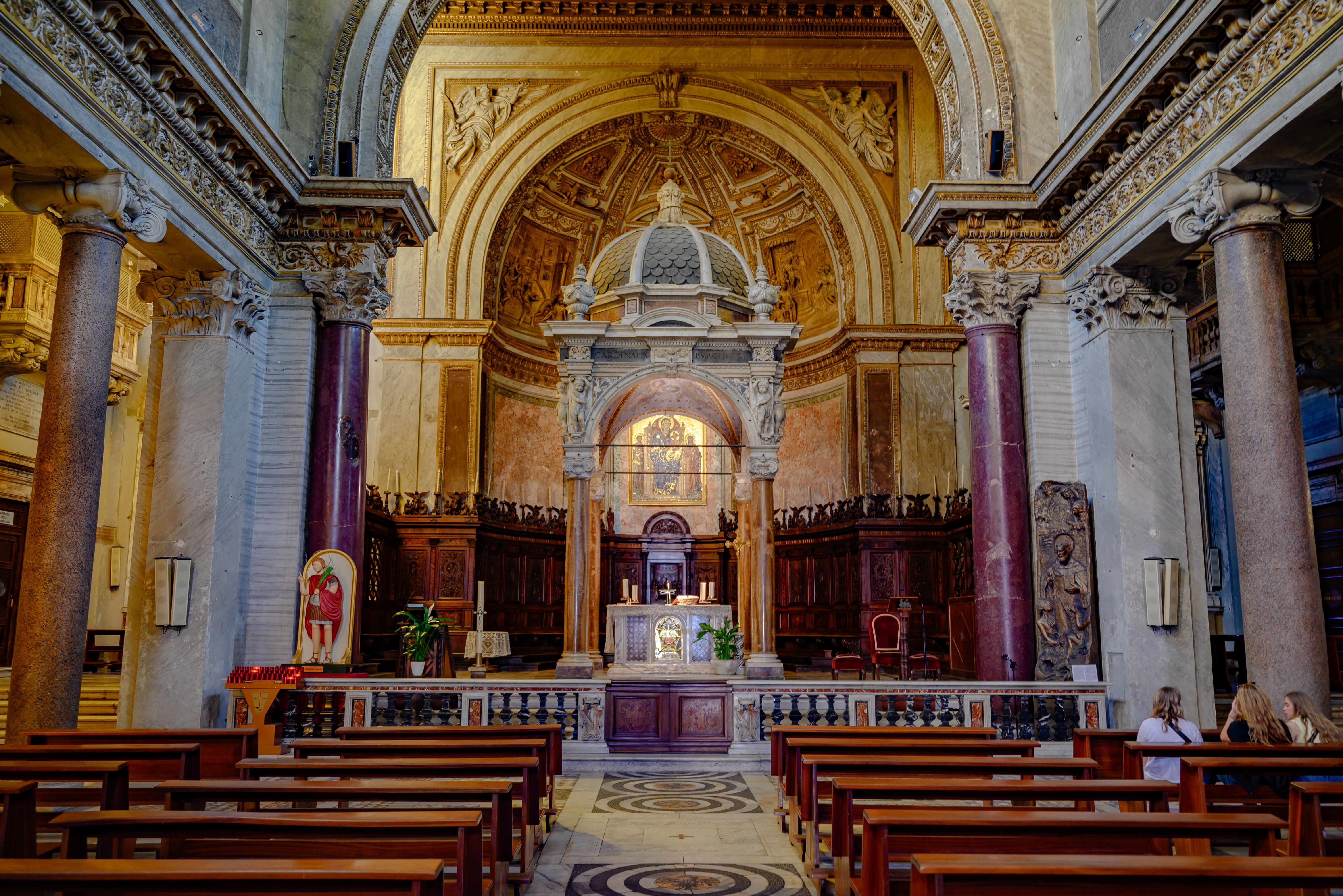 Beautiful Roman basilica interior with ornate architecture and historic religious elements.