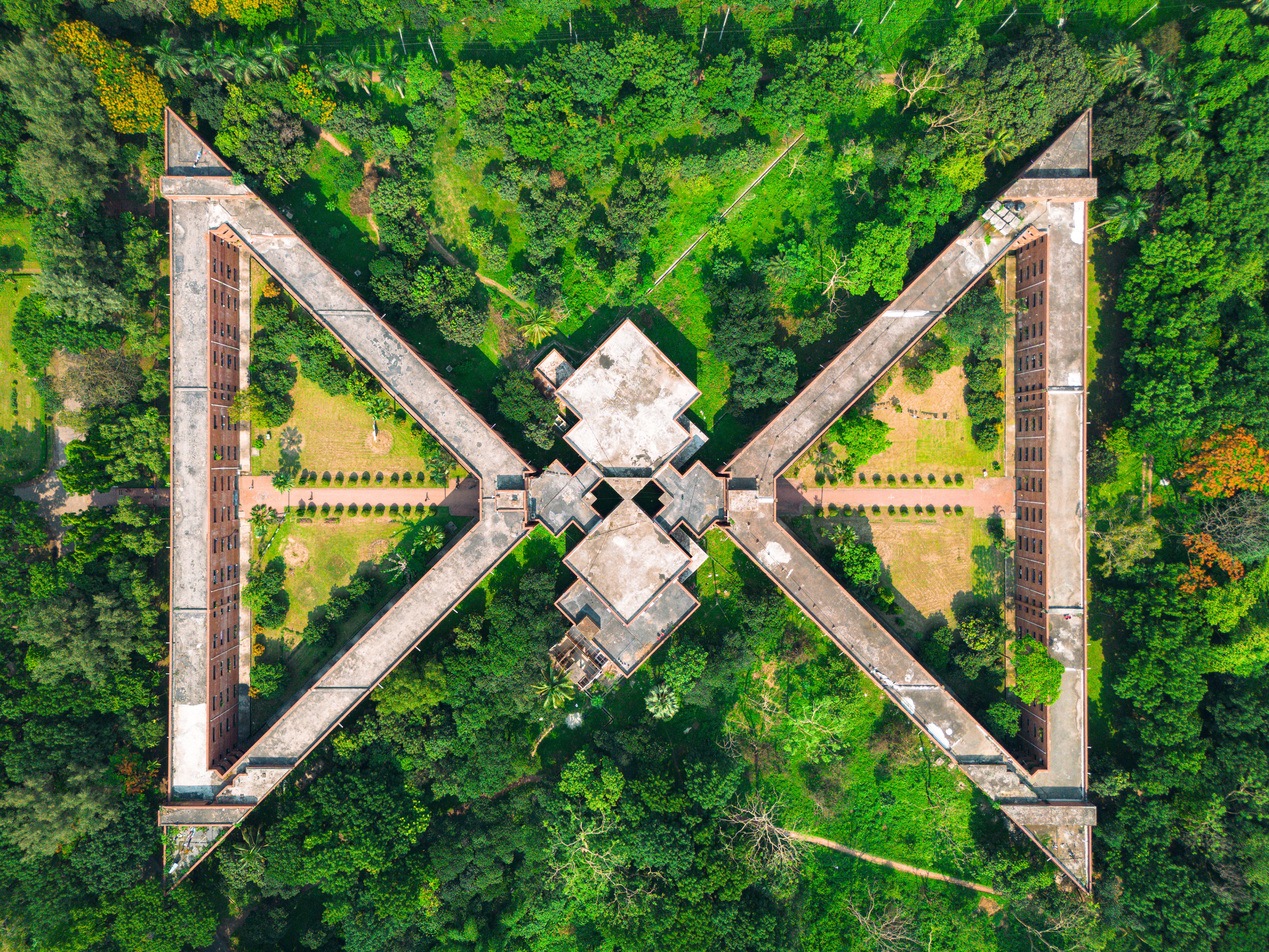 Stunning aerial capture of the National Martyrs' Memorial's architectural design surrounded by lush greenery in Savar, Bangladesh.