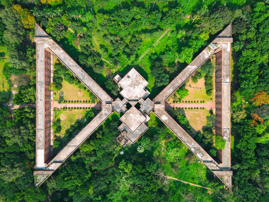 Stunning aerial capture of the National Martyrs' Memorial's architectural design surrounded by lush greenery in Savar, Bangladesh.