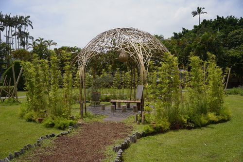 Free Tranquil bamboo pavilion surrounded by lush gardens in Taipei City, Taiwan. Stock Photo