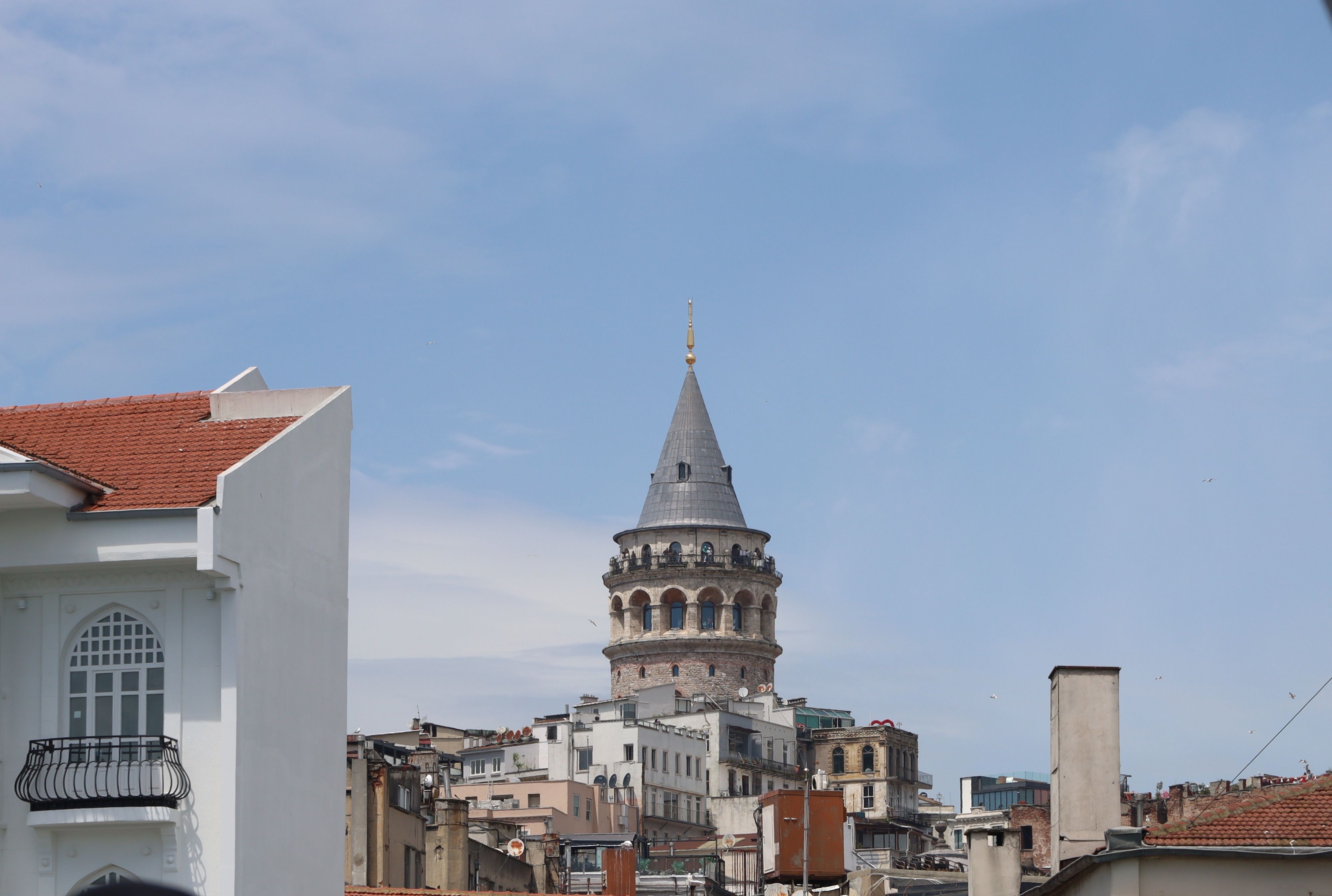 The historic Galata Tower rising above Istanbul's cityscape on a clear day.