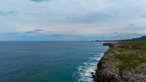 Free Breathtaking view of coastal cliffs and vast blue ocean under a clear sky. Stock Photo