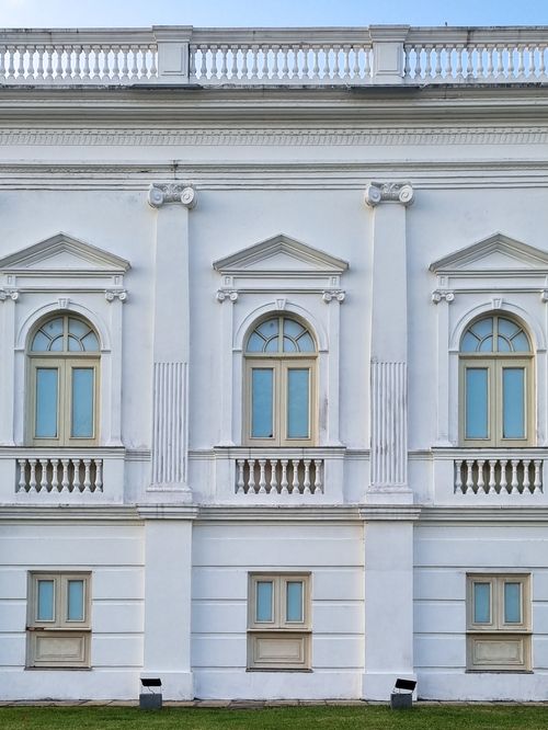 Free Elegant white neoclassical facade featuring arched windows in São Luís, Brazil. Stock Photo
