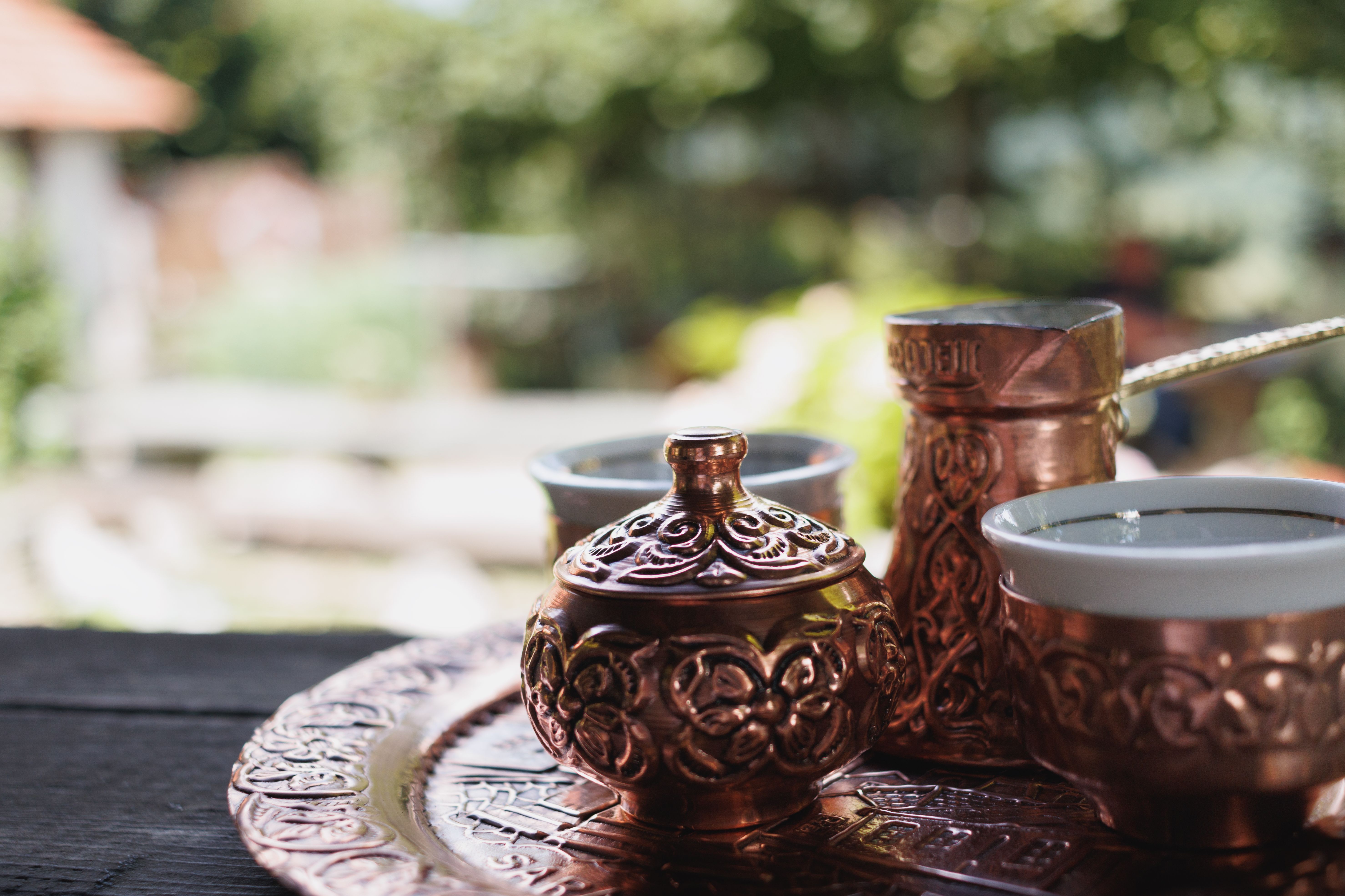 Delicious traditional Bulgarian banitsa pastry with a cup of coffee on a table.