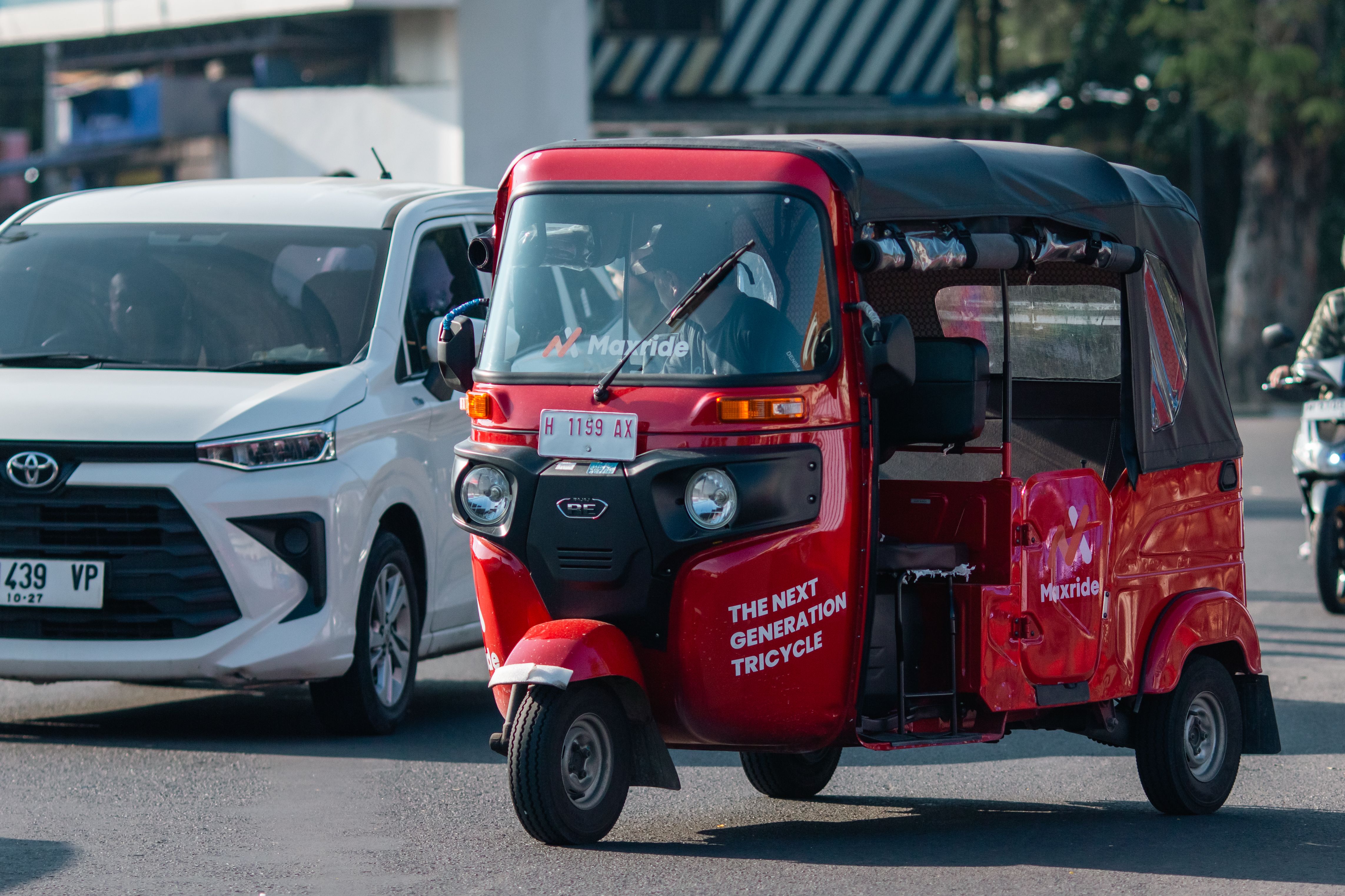 Red Auto Rickshaw on Busy Urban Street · Free Stock Photo